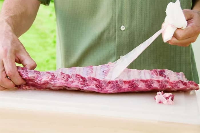 The membrane, the membrane is the thin clear thin light cream-colored skin that is on the backside of your rib, now some people keep it on but like to remove it because it gives me an even more tender piece of meat.