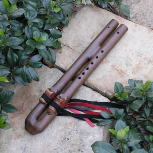 The mention of "pipes" along with flutes usually referred to any of the tubular instruments that you think about normally when you refer to flutes.