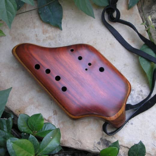 This instrument is based on the ancient version of a vessel flute mentioned in the Scripture verse above. They could be any shape or size depending on the maker and the desired pitch. Most are made of pottery, this one made of wood.