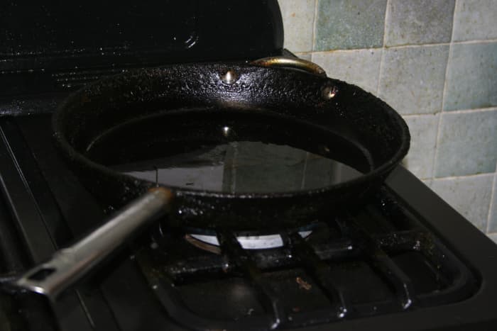 Put the frying pan on the stove with a little oil in it and start it heating, GENTLY - TAKE CARE