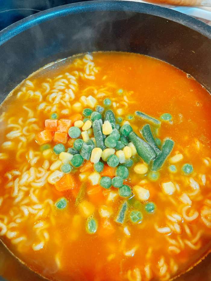 Add the frozen vegetables.