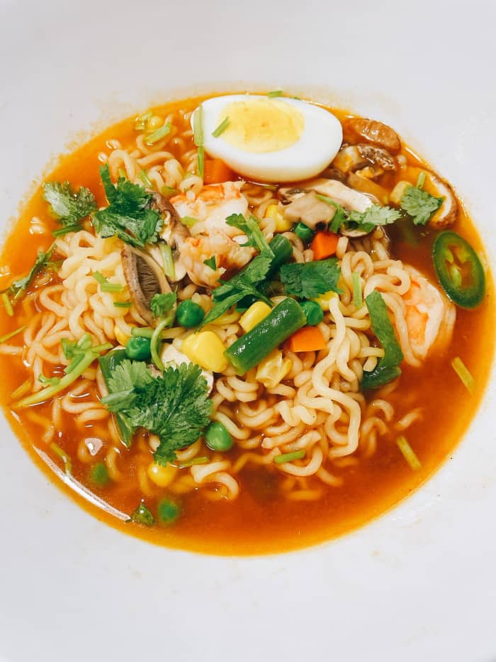 Transfer the ramen to a serving bowl.