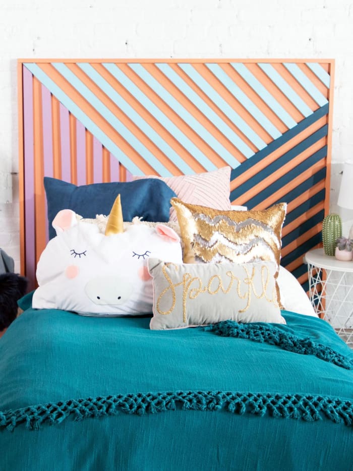 This DIY contemporary art headboard is the dream project for you if you're looking for a chic way to bring personality and color to your bedroom.