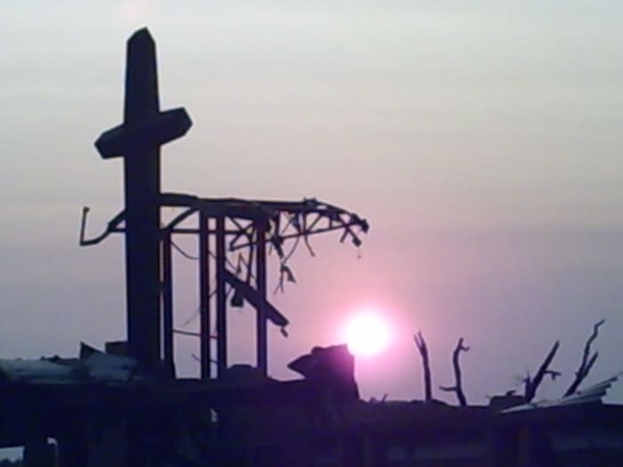 The remnants of St. Mary's Church, with the cross my Grandfather helped build still standing tall above the rubble.
