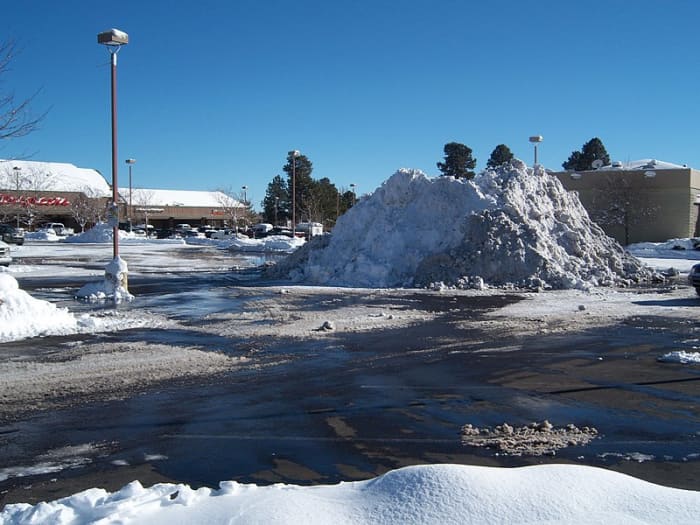 In the frigid Colorado climate, my earwax clog is frozen in place like this pile of dirty snow that won't melt until spring - on top of other physiological changes.