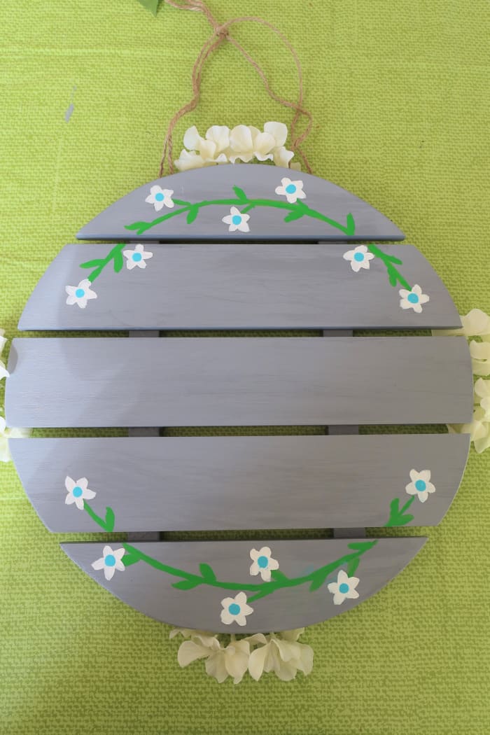 Add your twine or ribbon hanging cord so it will be in place before you add your flowers.