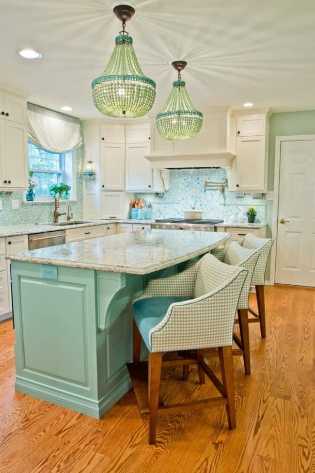 The turquoise and aqua kitchen is so beautiful, and they remind of all the shades you can see on the sand beach with the waves and the blue sky.