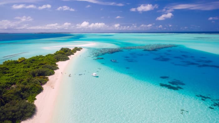 Paying your mortgage with a credit card may help earn travel awards that can get you to places like this lovely beach the Maldives.