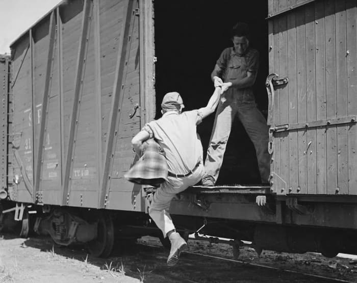 Jumping on a freight train was the best transportation for the hobo to travel for the hope of a job.