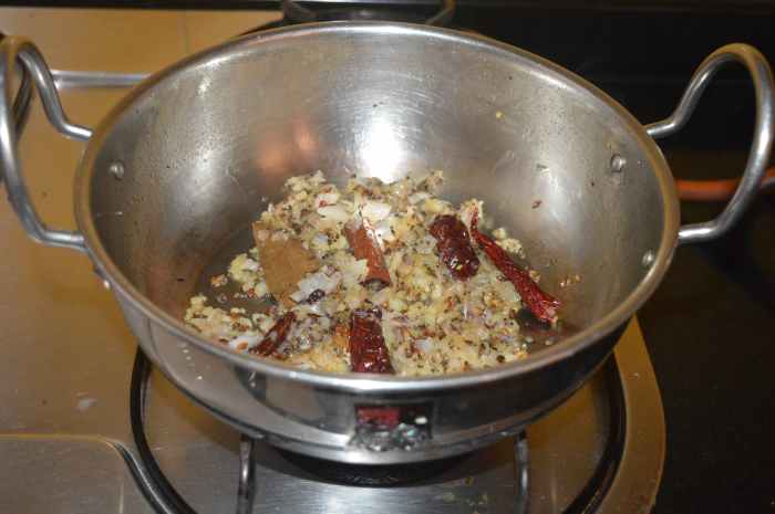 Add ginger-garlic paste. Continue to saute until the raw smell of the garlic goes away.