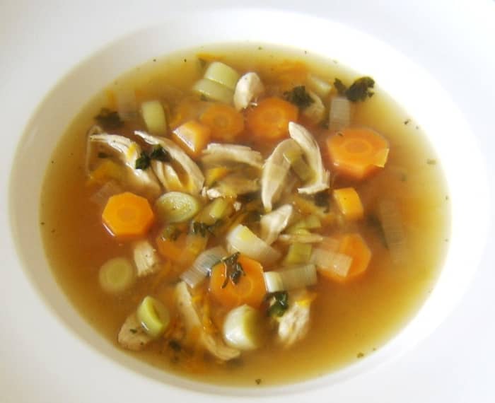 Leftover chicken, carrots and leek are the principal ingredients of this stinging nettle seasoned soup, which is served topped by homemade croutons