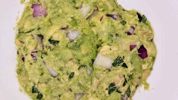 Day-old guacamole without a hint of brown. Pour off the water, remove any excess with a paper towel, and it’s ready to eat.