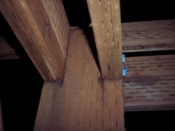 The 6x6 was notched to allow the 2x6 beams to sit on the top for support. This is one of the end columns where the beam meets the end. This design will support more weight than it will probably ever see. I didn't want rusty hardware to ever cause th