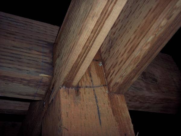 To span a deck that is longer or wider than the lumber, I set a column at the mid-span, notched it, and butted the two beams together on its top. The 6x8 on top was notched to sit over the butt joint which stabilized the joint and center span.