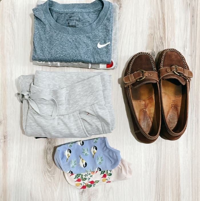 For a long-haul flight, I carry extra clean shirts and pants so I can change after 5–6 hours on the flight. As soon as I'm seated, I will change my sneakers to flat shoes or fresh socks.