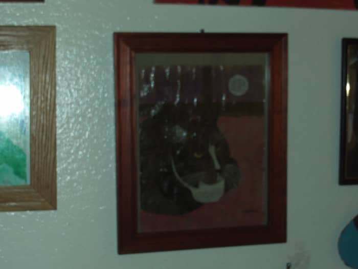 I selected a nice wood frame for my sketch of Bobby cat. Framing your art work makes it easy to display it on the walls of your home.