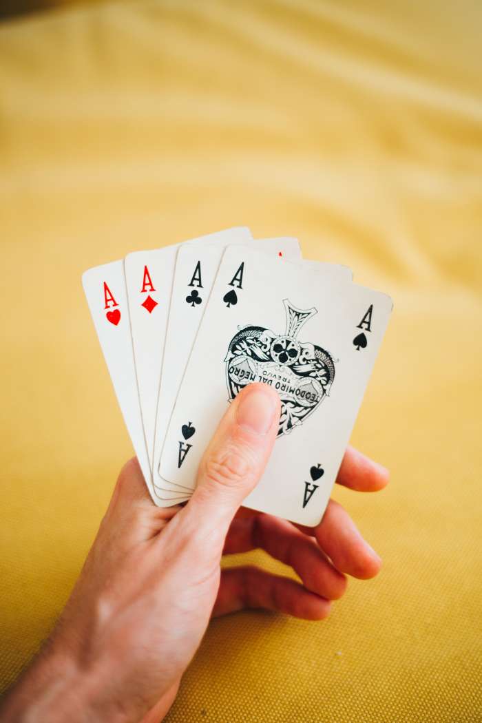 A tablecloth is easy to wash when your fellow card and Mah Jongg players leave. Photo by Oleg Magni from Pexels