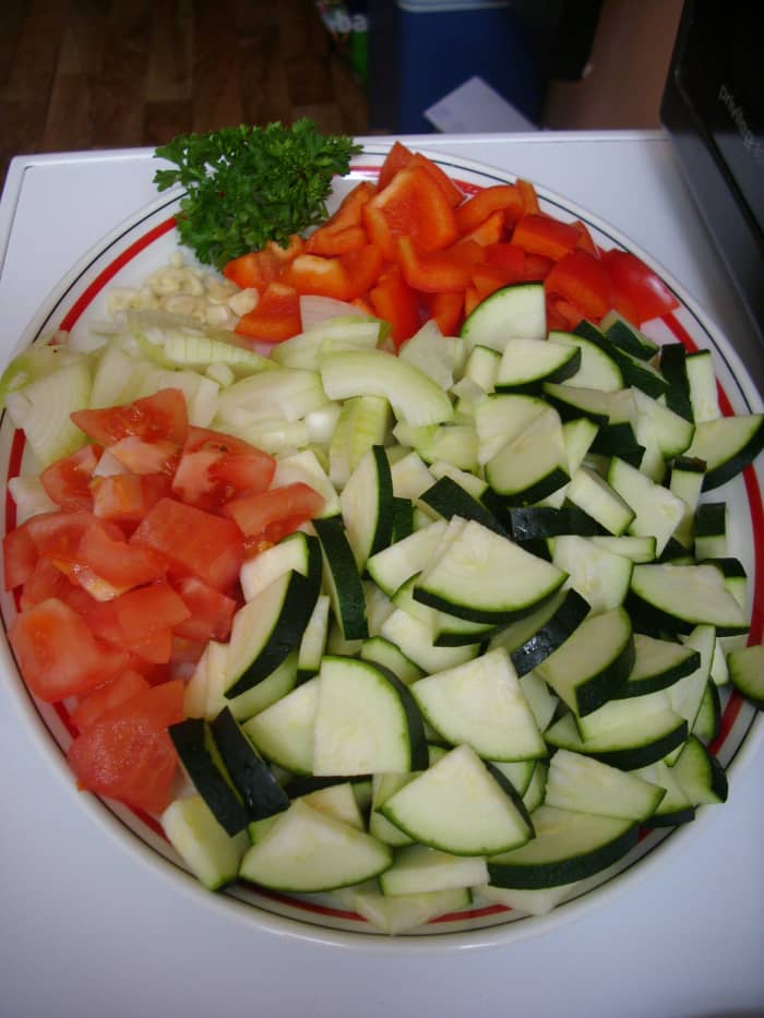 Vegetables for Ratatouille: tomatoes, zucchini, bell peppers, onions, garlic and parsley.