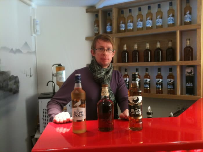 Sat behind the tasting bar at Glenturret after a day on the ski slopes at Glenshee