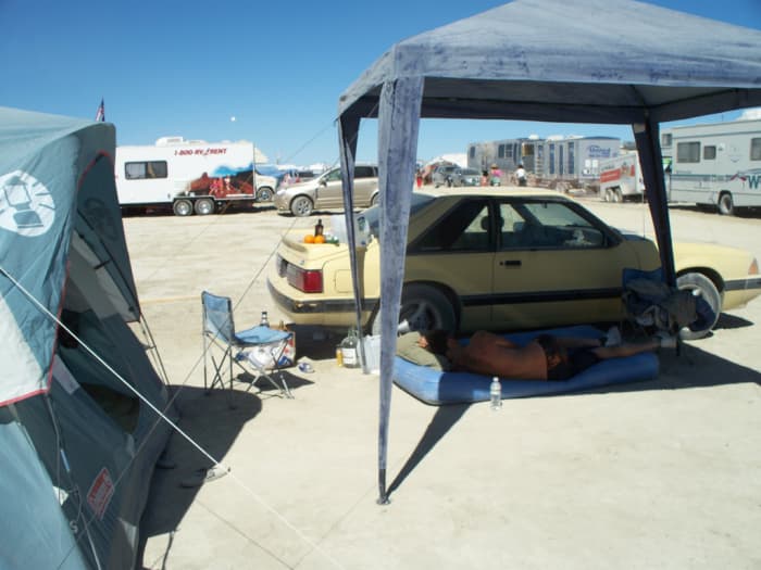 Feel free to go without a tent, but at least bring a good shade structure. Then add some shade cloth or tarps to keep the sun from coming in the sides.