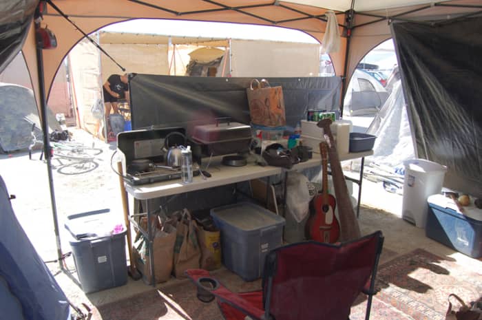 A well set up camp kitchen makes the entire week easier. Keeping at least some of the dust out is important.