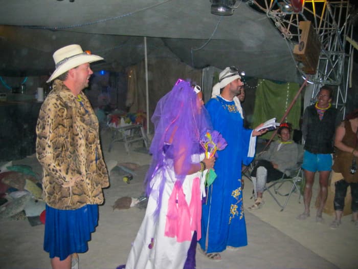 Several common Burning Man costume pieces here. Faux fur coat, skirt, tulle, robe, goggles, and dusty knees ;-)