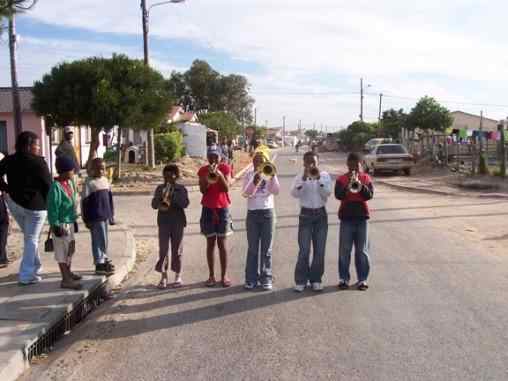 Kids being encouraged to create and play in a Brass Band. They need donation of both instruments and money