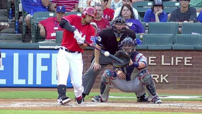 His eyes are on the ball, watching his bat hit it. The swing looks like he's going to hit the thing into the gap in the outfield.