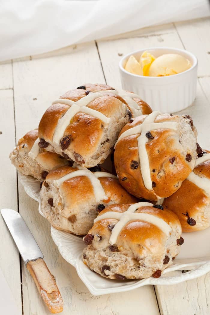 Hot cross buns made with raisins, candied citrus peel, and crosses of sweet white icing, have long delighted families on Easter morning, and if any are left over, they end up on the dinner table.