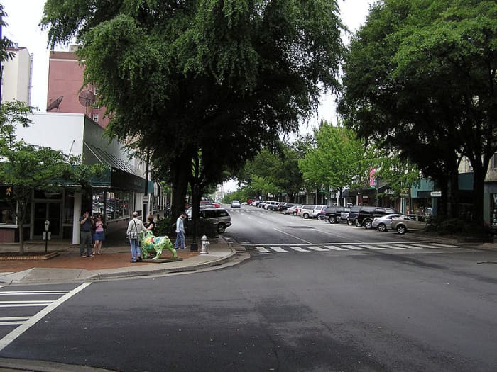 This Downtown Athens scene not far from UGA shows one of the artistically decorated Bulldog stautes throughout town in mid-2008. This was a nationwide project, in which Cincinnati had Pigs and Columbus OH had decorated Ears of Corn around town.