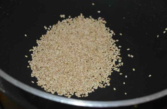 Step one: Dry-roast the sesame seeds in a pan. Transfer them to a plate and allow them to cool.