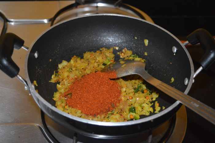 Add rasam powder and mix well.