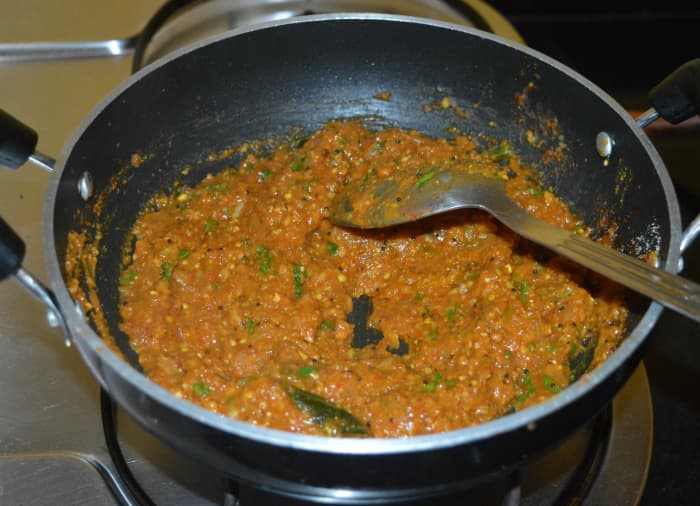 Check for taste and consistency. Add red chili powder, salt, or water if needed. Mix well. This curry should have semi-solid consistency.