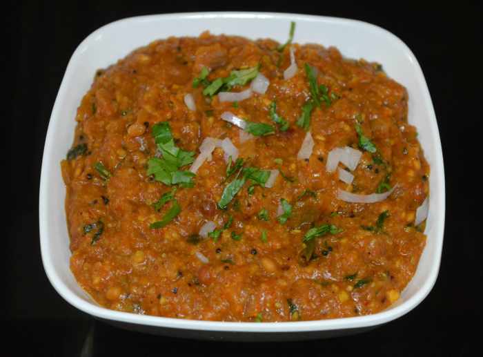 Garnish it with chopped onions and freshly chopped coriander leaves. Serve this curry hot with jolada roti, chapati, poori, or cooked rice. Enjoy!