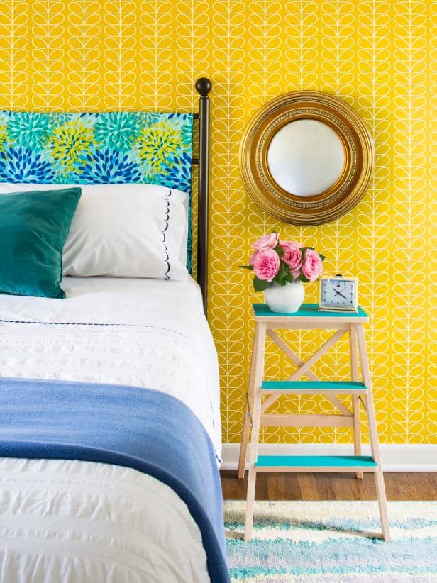 The little wood ladder has used the side table bed. The metal headboard and the yellow beautiful wall.