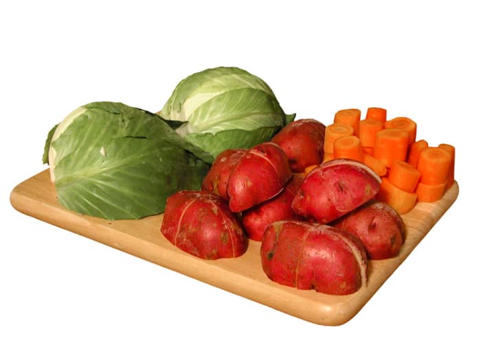 Cabbage, carrots, and potatoes washed, trimmed, and ready for chopping, dicing, and slicing.