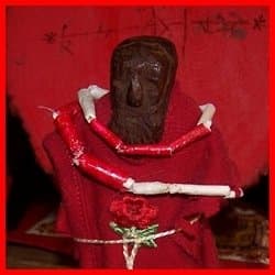 My Legba likes this tiny statue I dressed in red and made the paper bead necklace for in keeping with his Haitian colors.