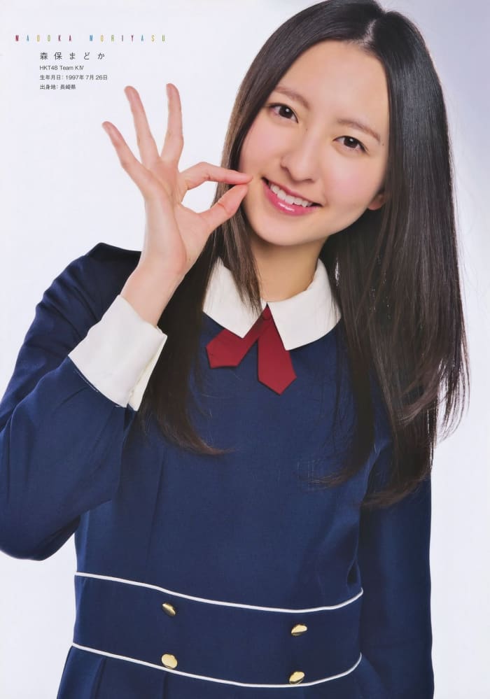 Madoka Moriyasu in a magazine photo session dressed in a traditional uniform.