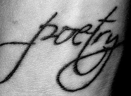 A tatoo of the word "poetry" symbolizes the closeness of the art to the poet's soul.