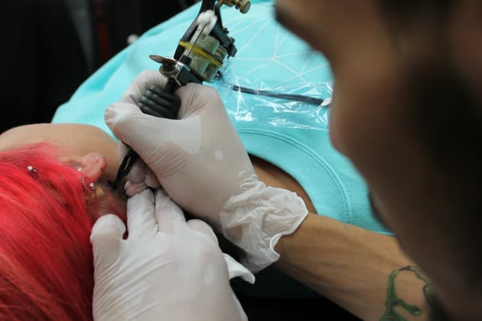 Tattoos and piercings are two common types of body modification, but they're not the only varieties.