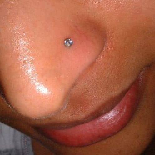 A simple stud worn in a nostril piercing. The bead on the outside has to be large enough that it doesn't sink down into the piercing itself.