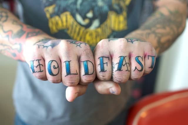"Hold fast" is a reference to holding onto the lines of a ship during a storm.