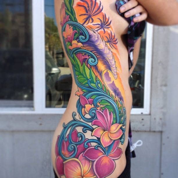 Female, full colour rib (side) tattoo.