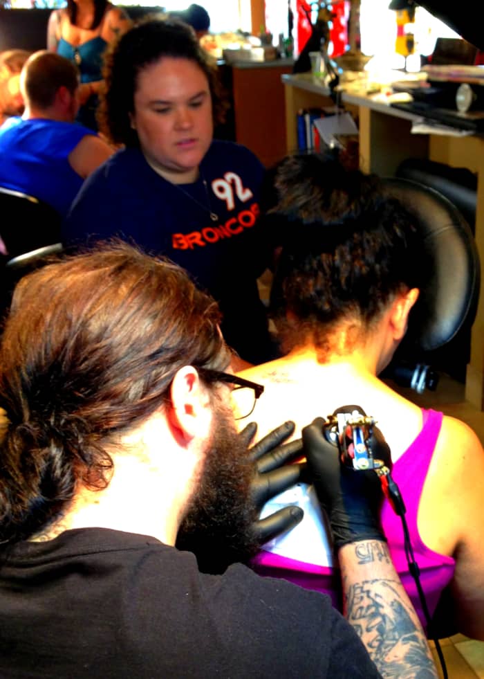 Bringing a friend on tattoo day ensures a more comfortable experience -- and an extra set of eyes to double-check the design.