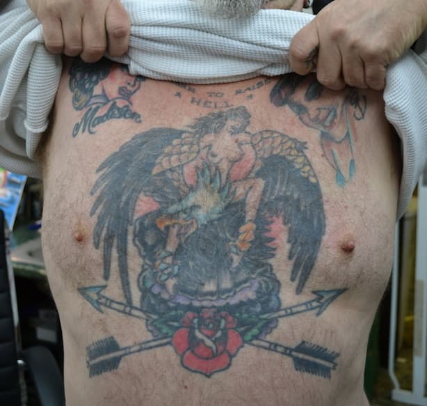 Sailor Eddie's chest art was inked by tattoo artist Mike Wilson during a visit to Ed's shop. Sailor Ed tattooed Wilson's chest piece on the same visit.