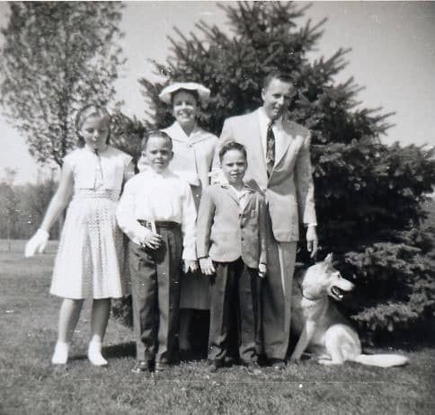 Our family back then. My brother holding the candle was in honor of his First Holy Communion. We were older at this point and the rag man threat no longer worked.