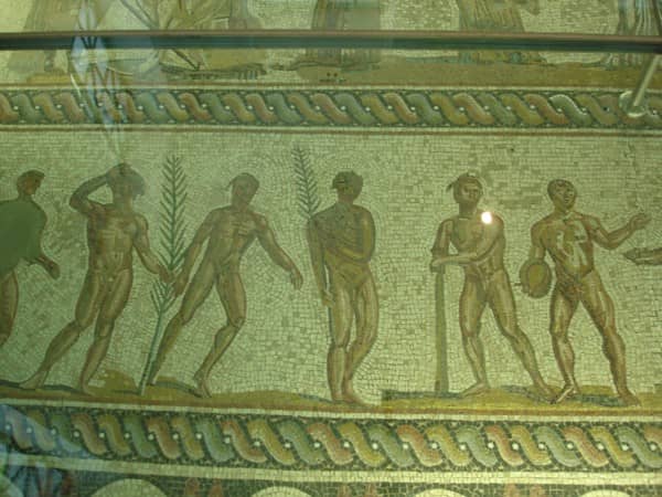 Mosaic flooring depicting the winners of various events wearing wreaths.
