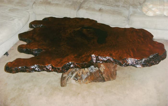 A unique blend of old, rough driftwood for the base and beautifully finished redwood burl for the table top.