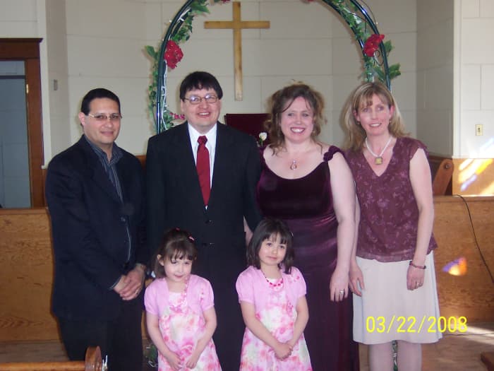 You can see the archway in the background. My husband and I are in the middle, with my sister and her family.