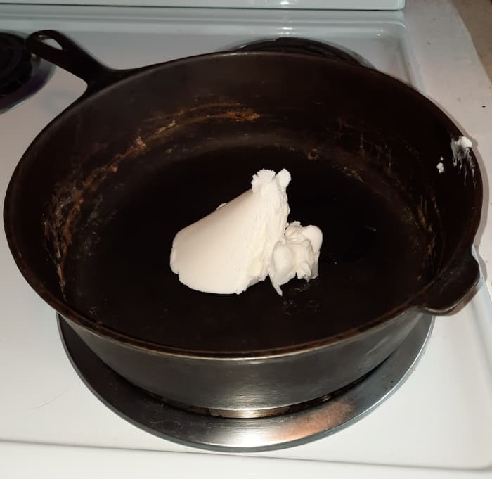 Step 3: To fry my one squirrel, I put about a cup of Crisco in the skillet and started heating it on a low setting.